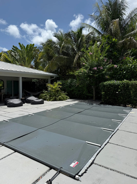 Manual Safety Pool Cover installed on a rectangular pool in Miami